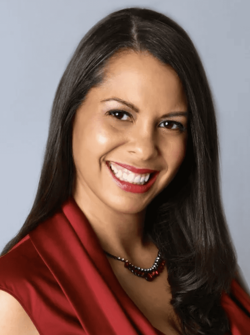 therapist brown hair red dress smiling