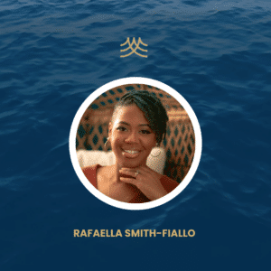 Person smiling with ocean background