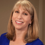 Woman smiling in blue shirt