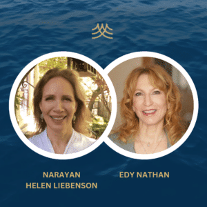 Two women smiling with ocean background.