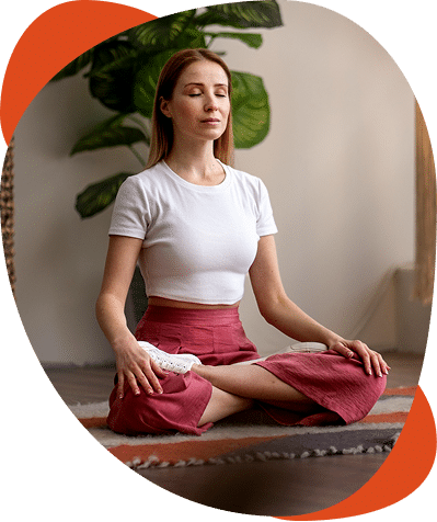 Woman meditating in peaceful indoor setting
