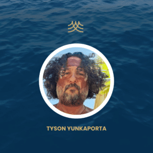 Person with face paint and curly hair.