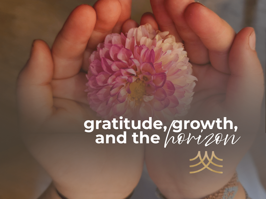 Hands holding a pink flower, gratitude message.