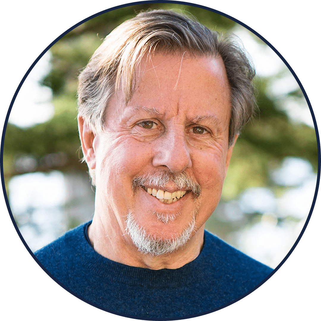 Smiling older man outdoors with gray hair