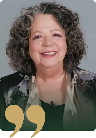 Smiling woman with curly gray hair portrait