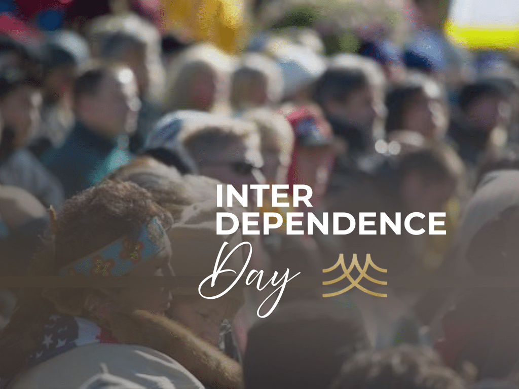 Crowd celebrating Interdependence Day at outdoor gathering